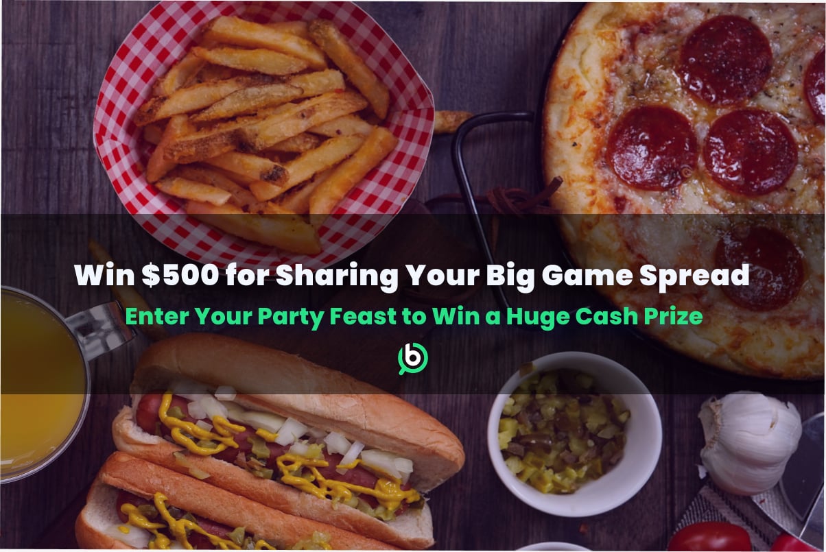 Table filled with various game day foods and snacks