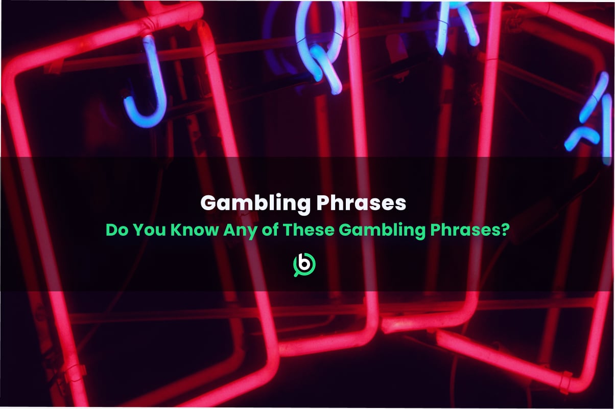 Neon signs of playing cards with glowing red and blue lights, featuring the text “Gambling Phrases – Do You Know Any of These Gambling Phrases?”