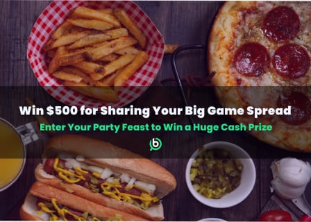 Table filled with various game day foods and snacks