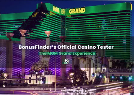 Exterior of the MGM Grand casino in Las Vegas lit up in green and purple lights, with overlaid text “BonusFinder’s Official Casino Tester – The MGM Grand Experience.”